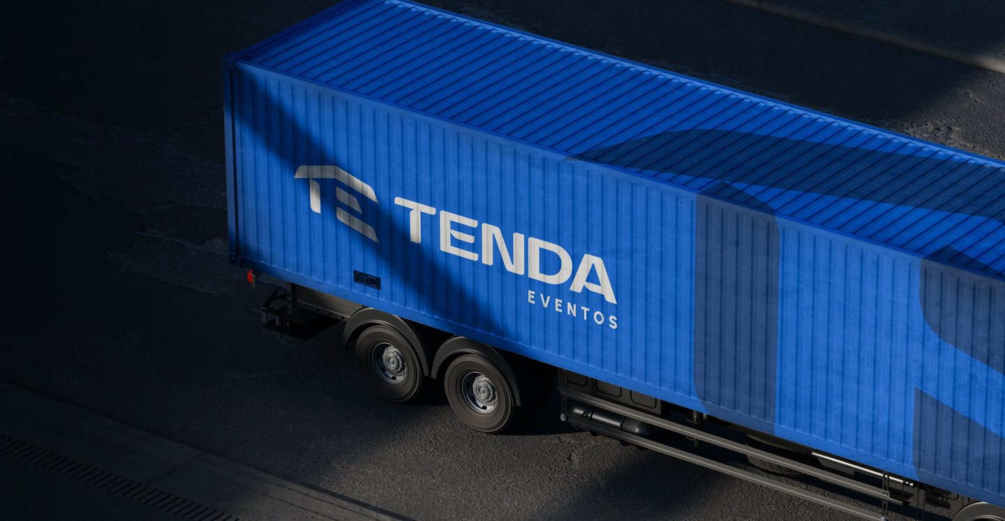 Blue Tenda Eventos logistics truck trailer transporting event equipment on a road.