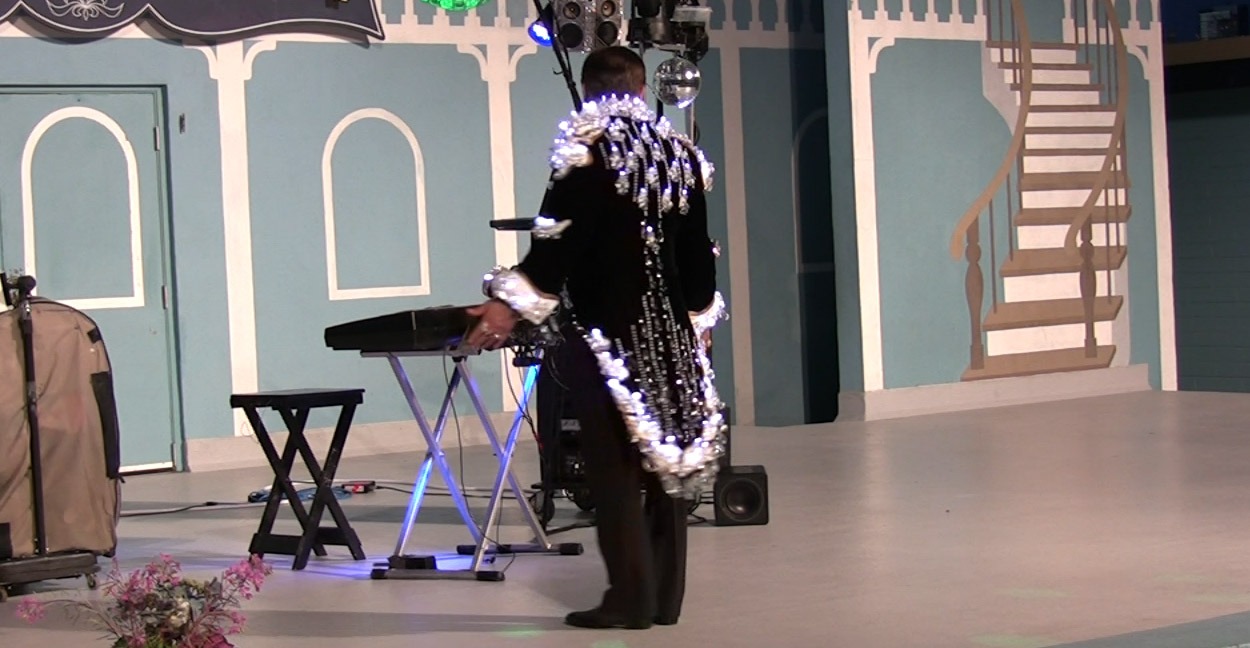 'The Chandelier Jacket' from the back during a performance by 'HencetheOutfit'