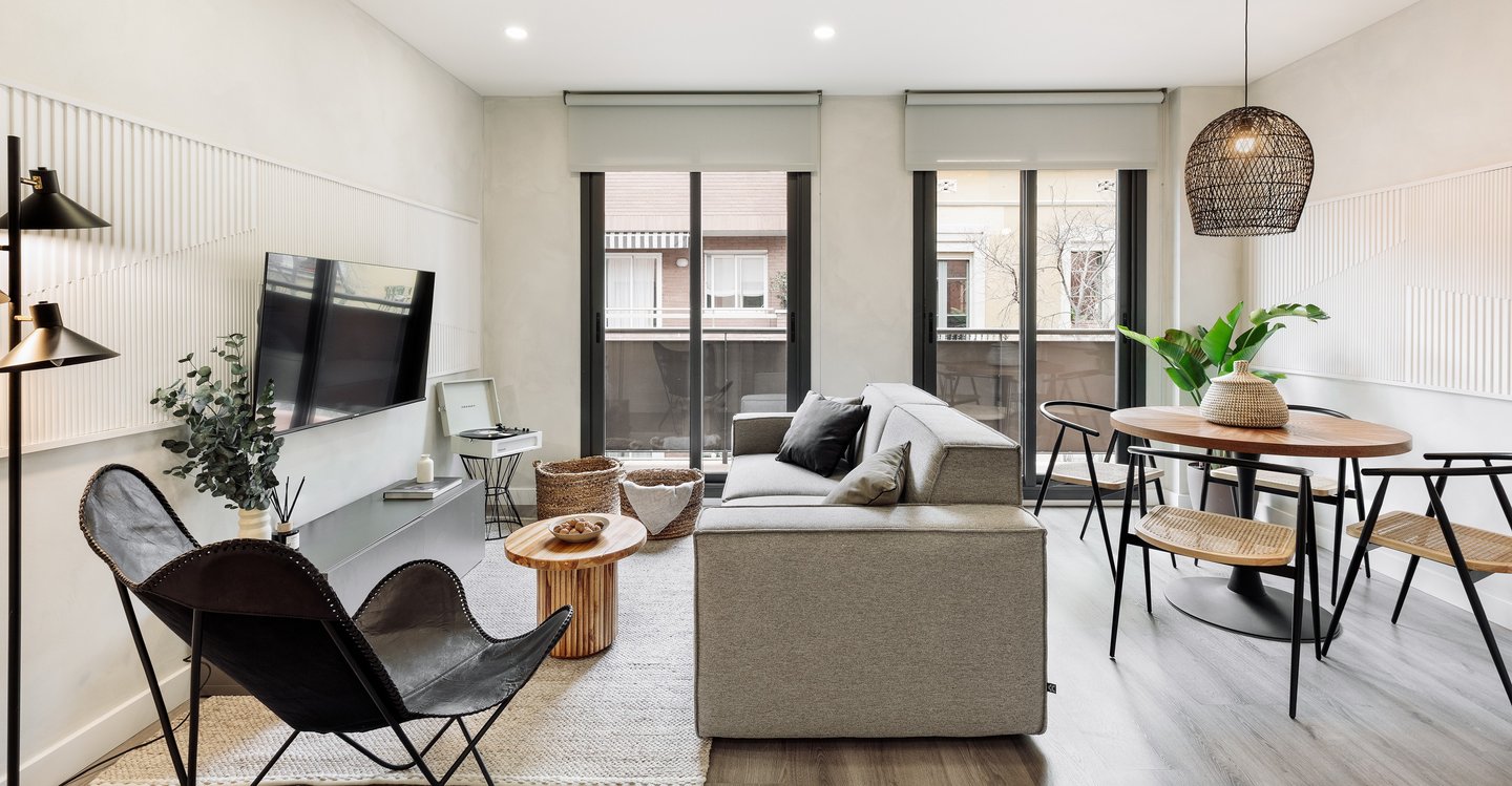 Bright living room with big windows and contemporary interior design, black accents and modern touch