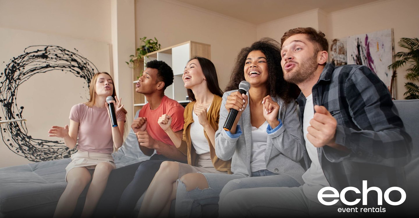 Group of friends enjoying a karaoke night with wireless microphones, rented from Echo Event Rentals