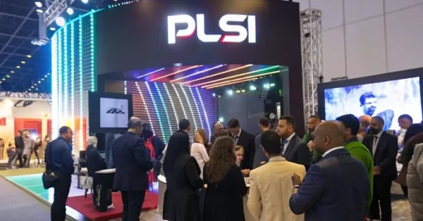 Technician installing large-format printed signage at event venue