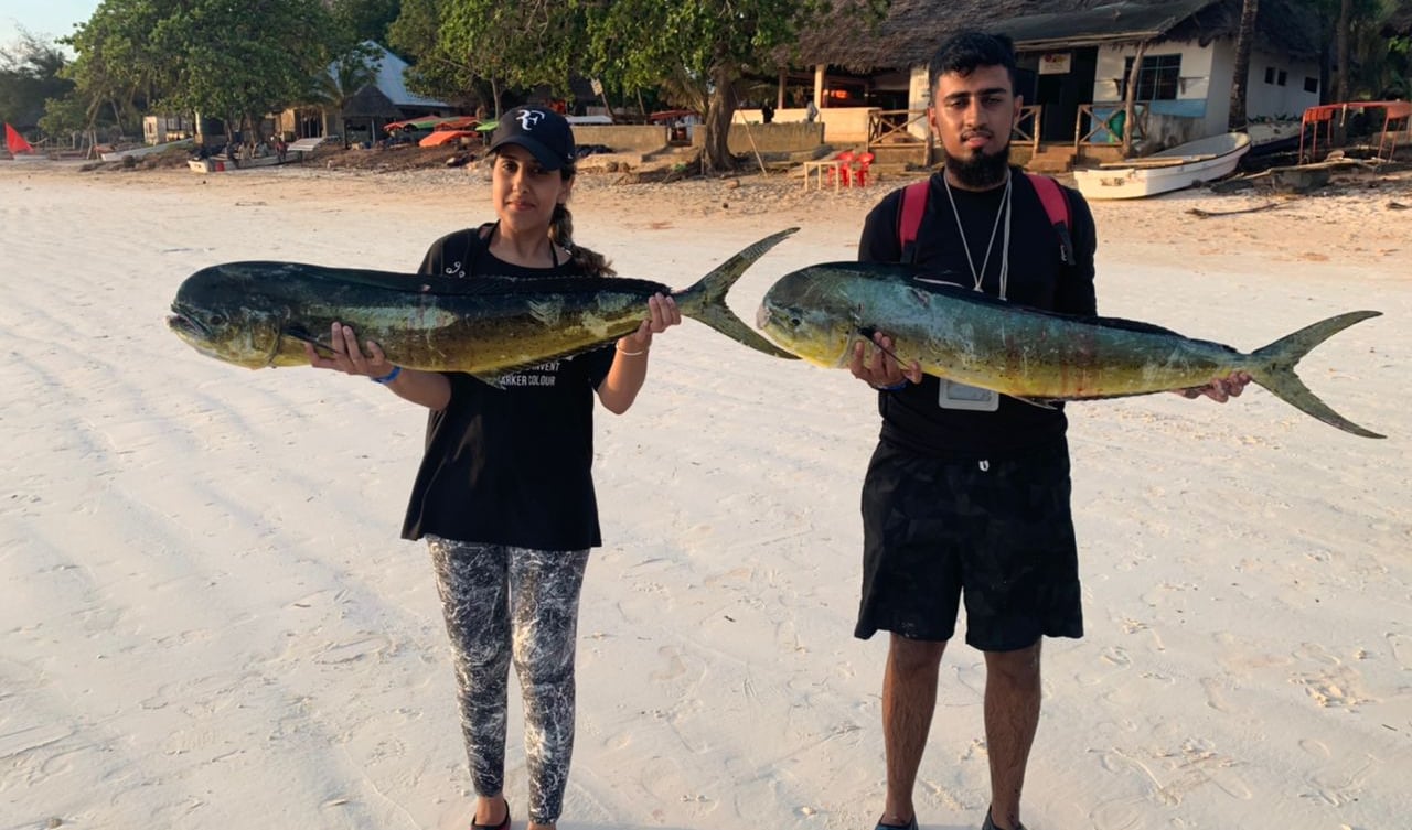 Happy anglers on a Zanzibar fishing charter with Zanzibar Angler's Paradise.