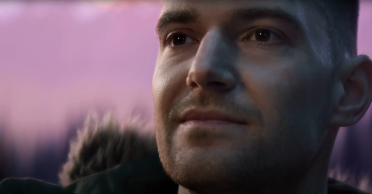 a man with a beard and a beard, looking at the camera