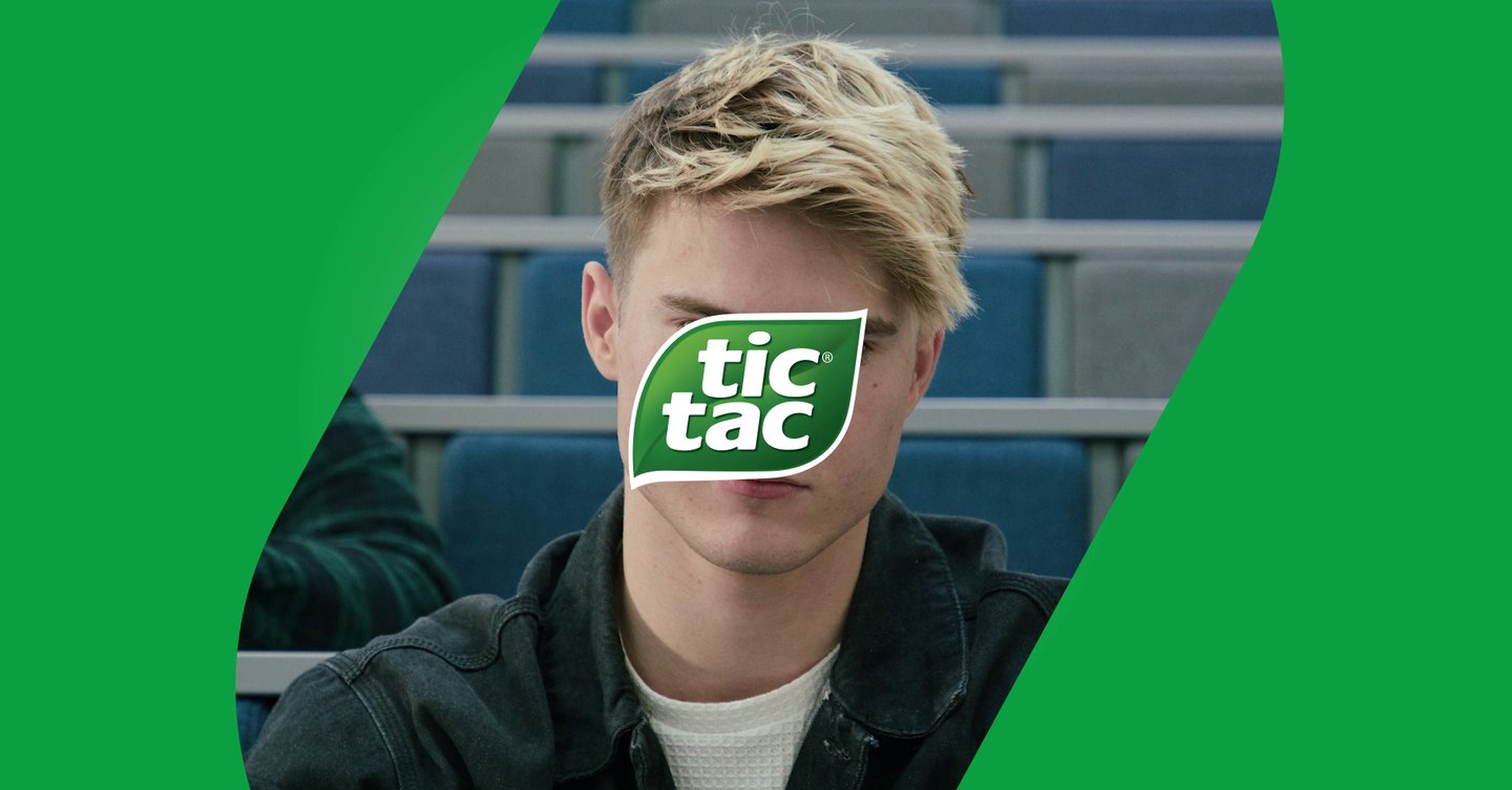 a man with a green sticker on his face