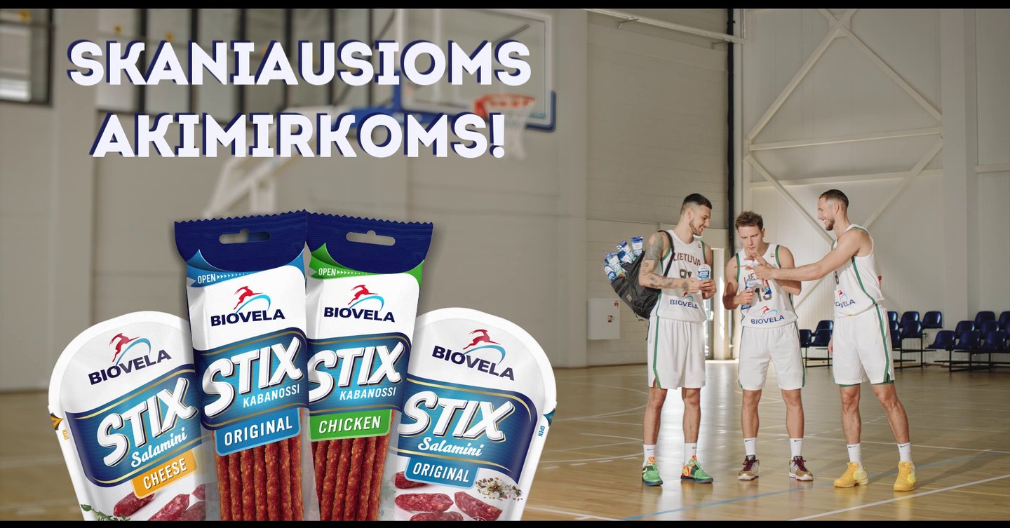 a group of men standing around a basketball court