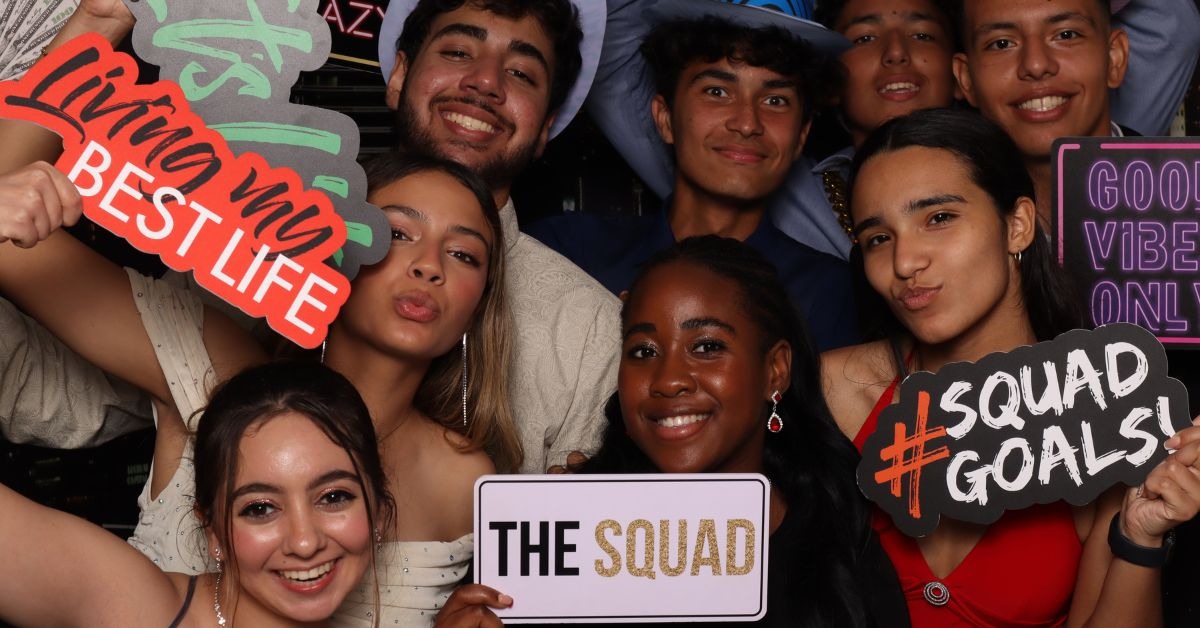 Group of teenagers posing for a photobooth photograph