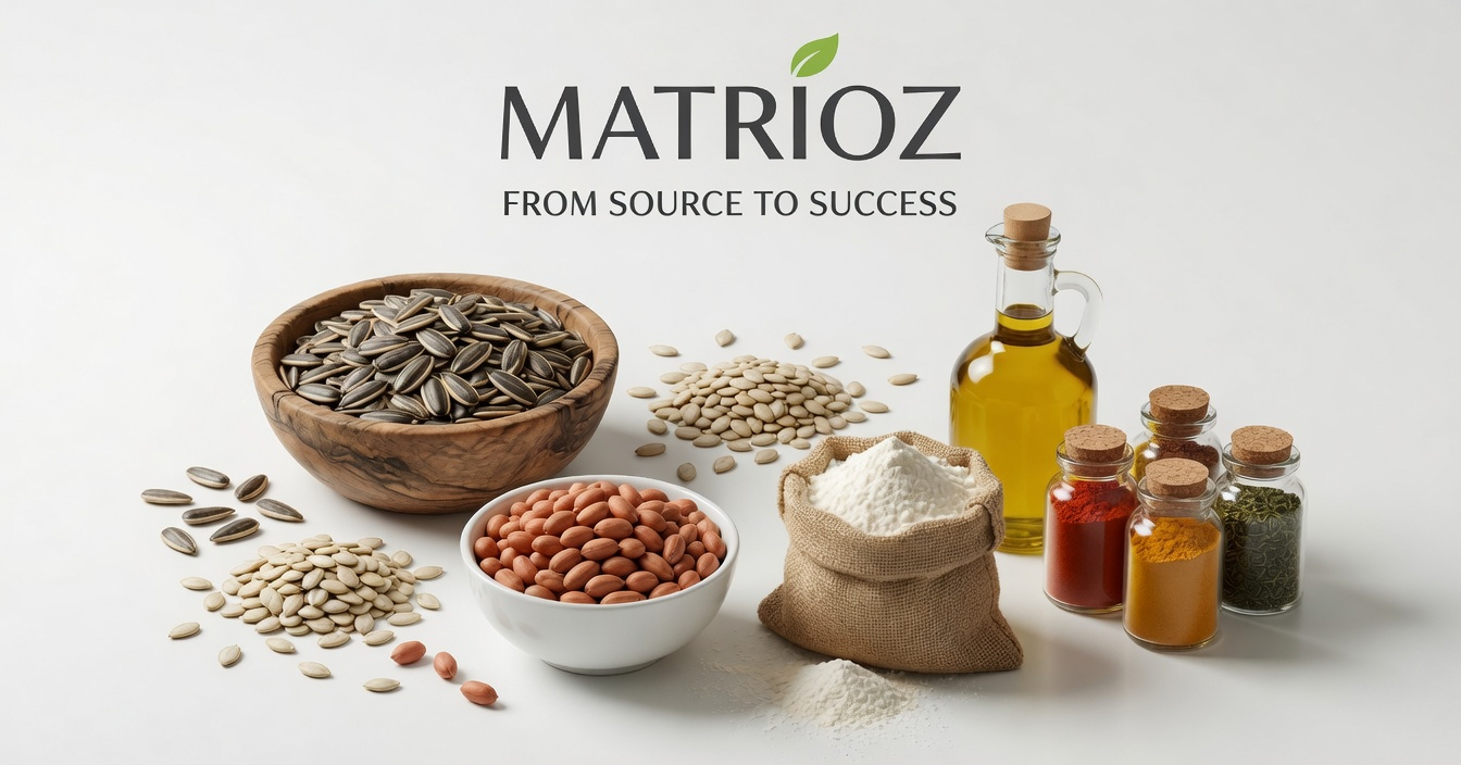 A selection of raw sunflower seeds, peanuts, flour, spices, and olive oil for food manufacturing.