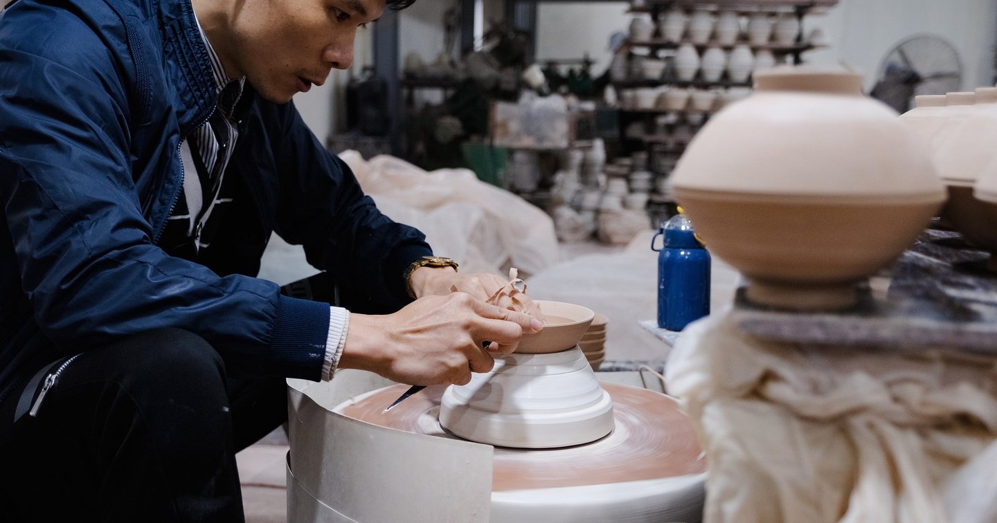 Handcrafted porcelain tableware laid out for selection