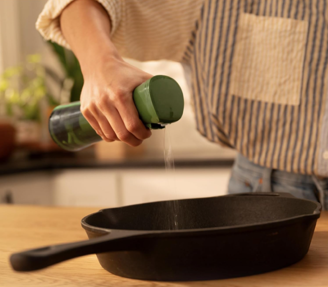 Avocado oil and ghee on a clean kitchen counter — non-toxic high smoke point cooking fats