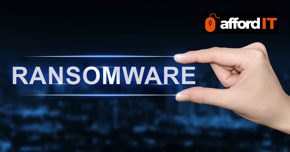 A hand grasping the word Ransomware representing cybersecurity threats and data protection services.