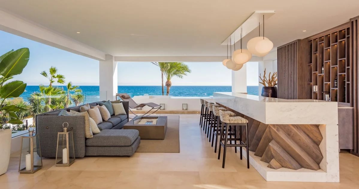 Covered terrace lounge and bar overlooking the Mediterranean