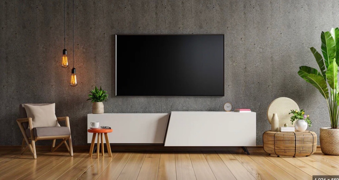 tv mounted on concrete wall