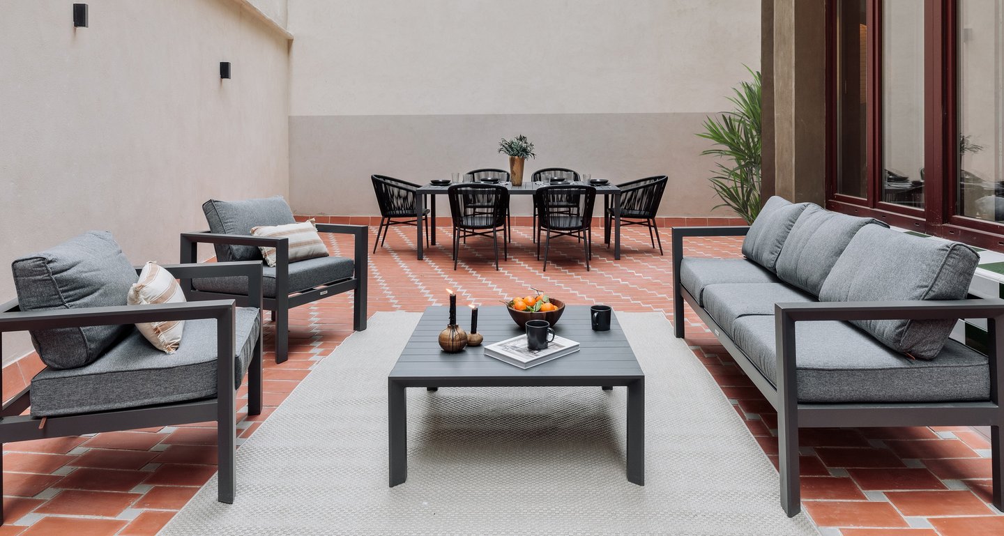 Private terrace with seating, dining area and plants, designed by SAVIA