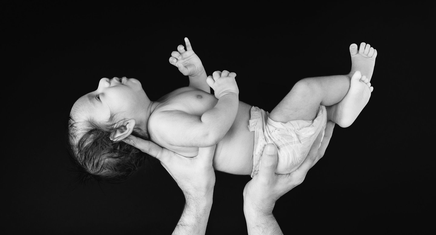Close-up of tiny newborn feet captured in a heartwarming photography session.