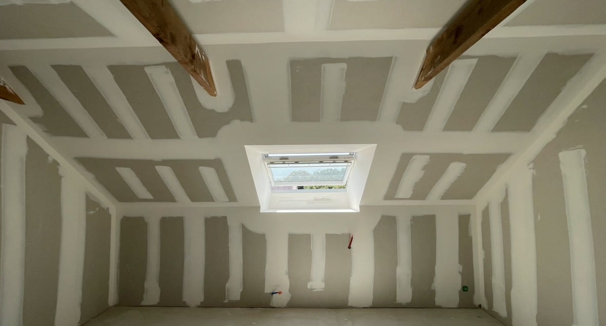 a room with a skylight and a skylight