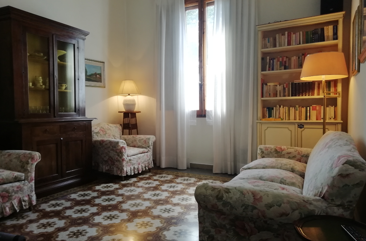 a living room with a couch and chairs