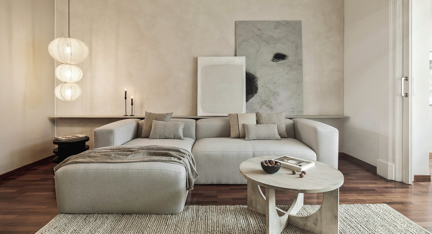 Sophisticated Living room with modern decor, custom lighting, a neutral color palette and art