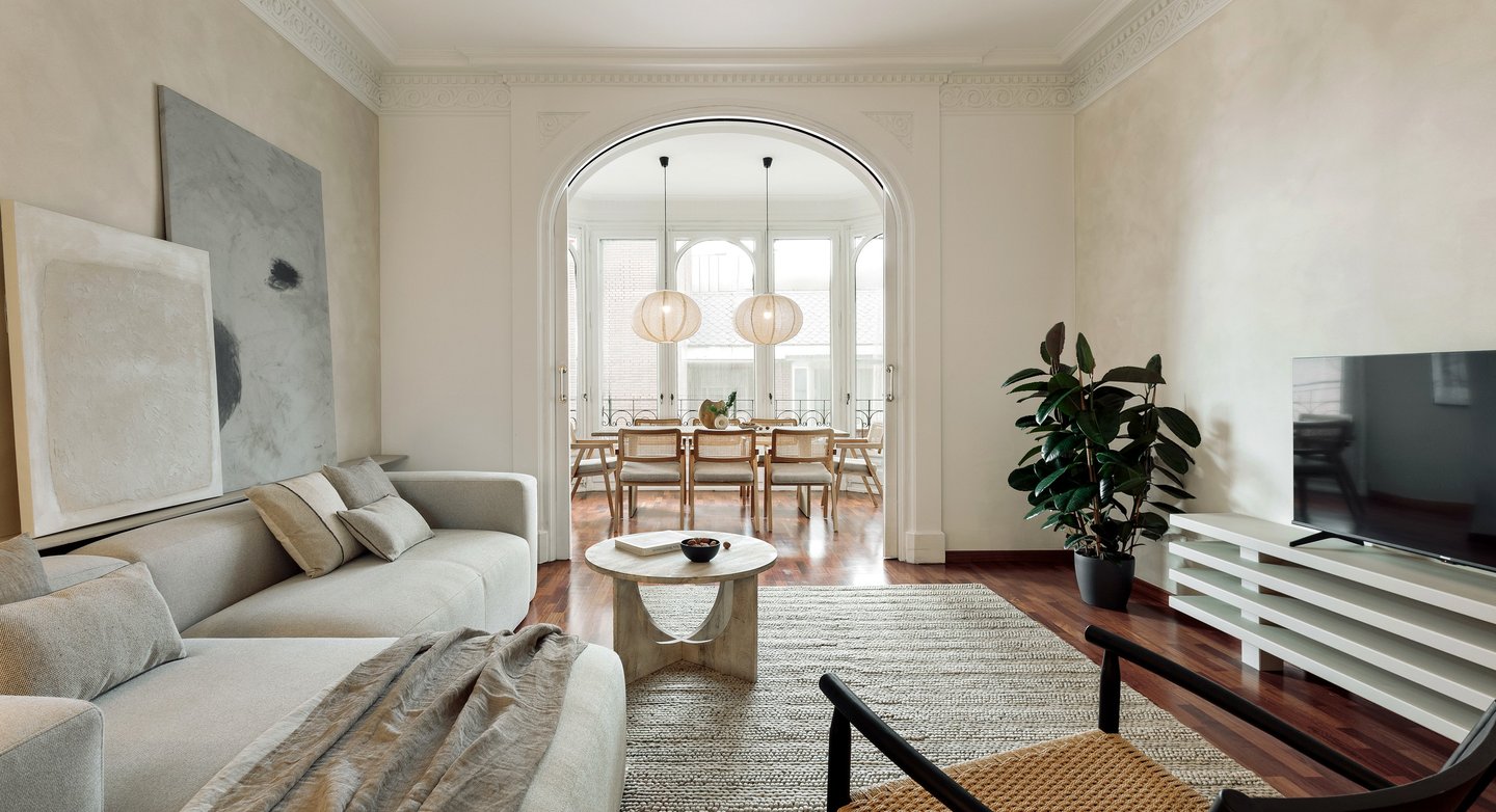 Sophisticated Living room with modern decor, natural materials, and a neutral color palette and art