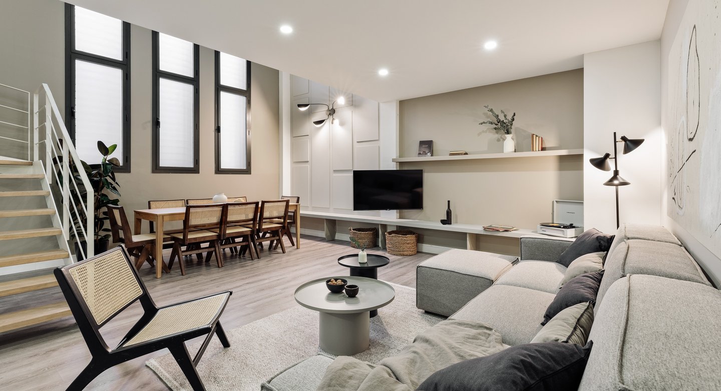 Contemporary loft apartment with a minimalist design, subtle lighting, neutral colors in Barcelona