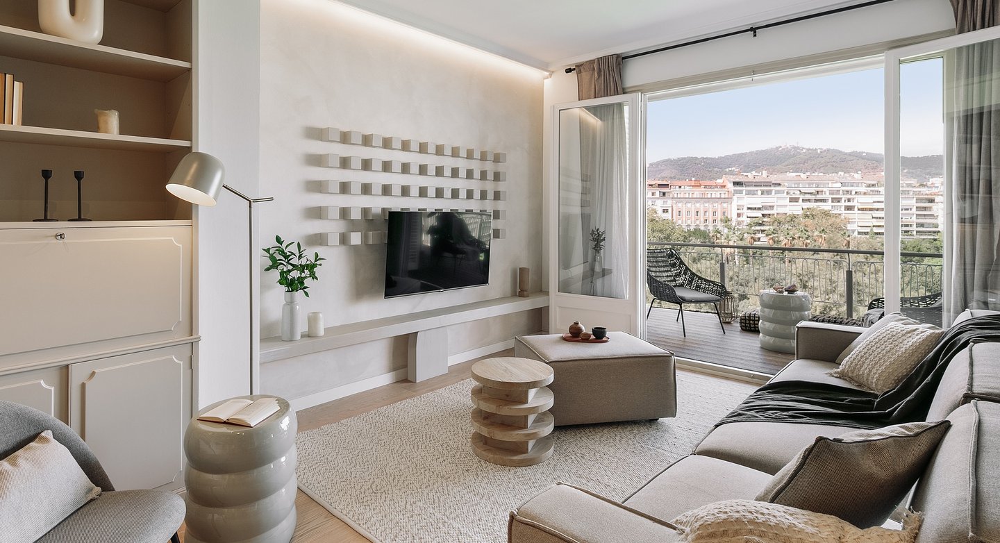 Elegant living room with bespoke wall installation, neutral tones, and subtle textures by SAVIA