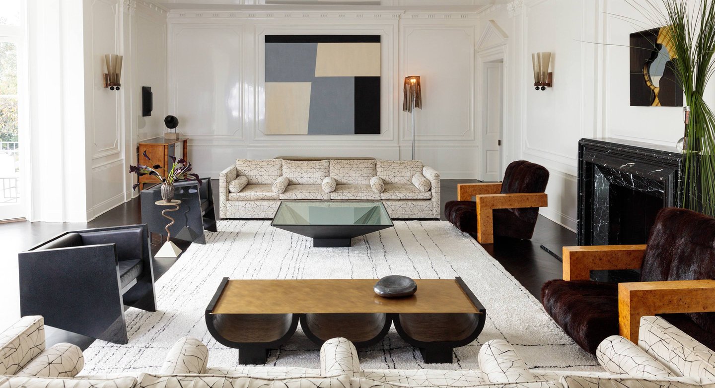 Kelly Wearstler design- living room with a couch and a fireplace.