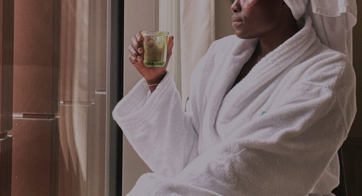 A lady sitting and enjoy a self care moment
