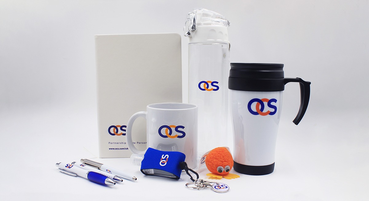 OCS corporate merchandise kit with branded drinkware, mug, notebook and office accessories