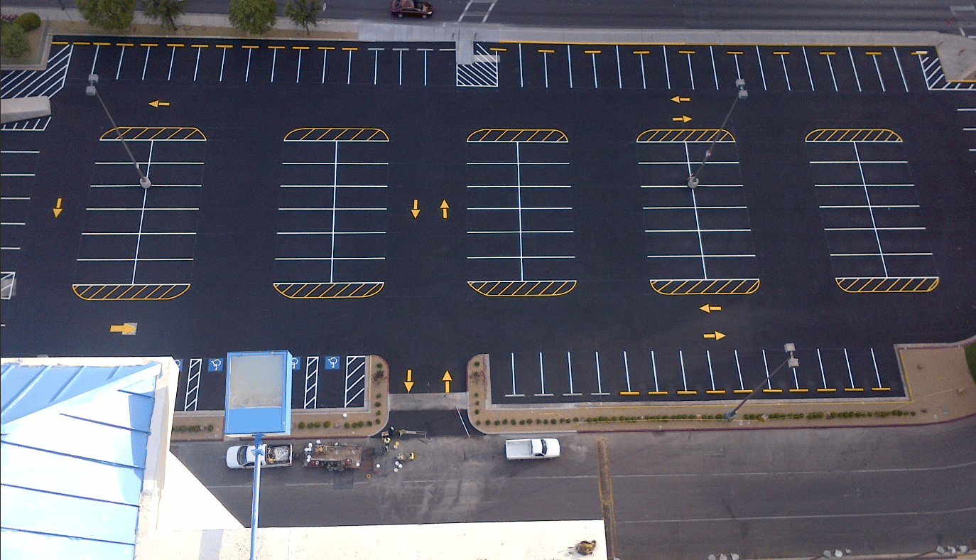 work crew striping a parking lot