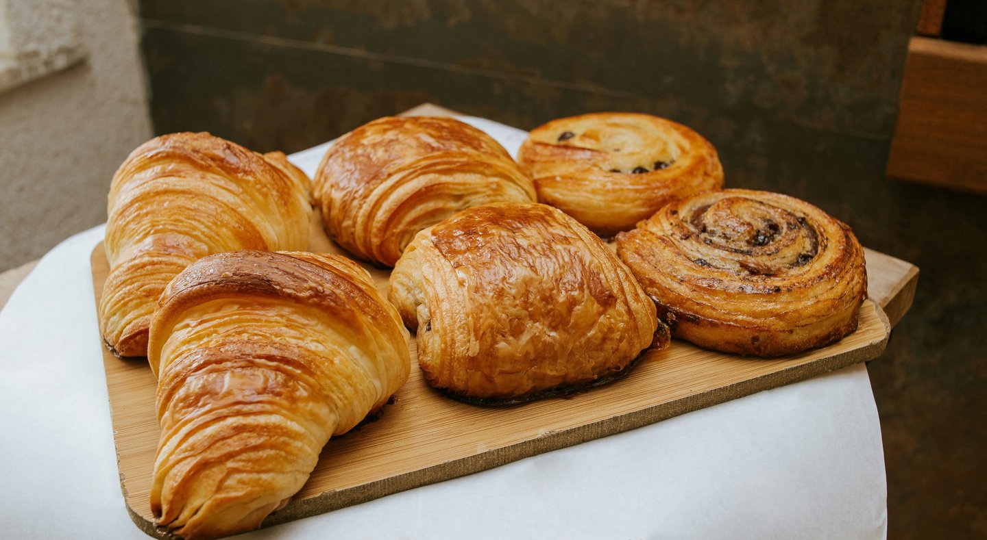 Fresh croissants and French pastries in Paris bakery display