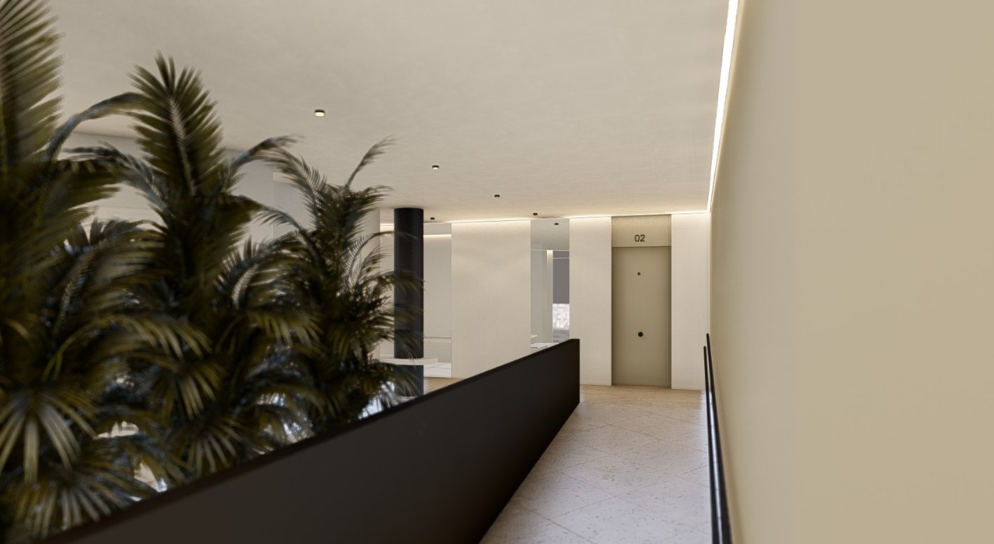 a long hallway with a planter and a planter