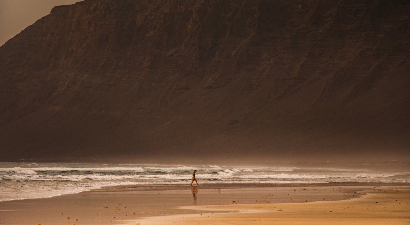 a person standing on a beach 
