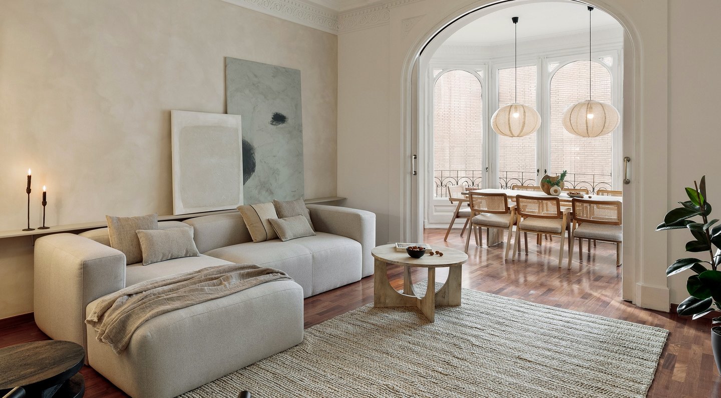 Sophisticated Living room with modern decor, natural materials, and a neutral color palette and art