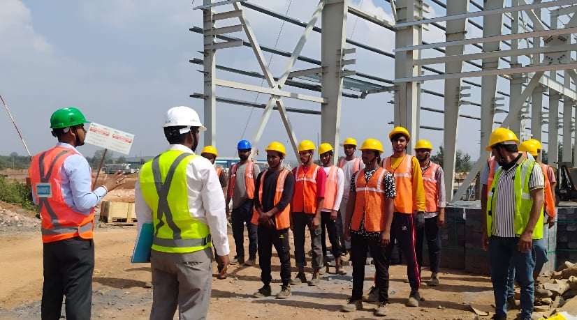 Construction work in progress with workforce and equipment