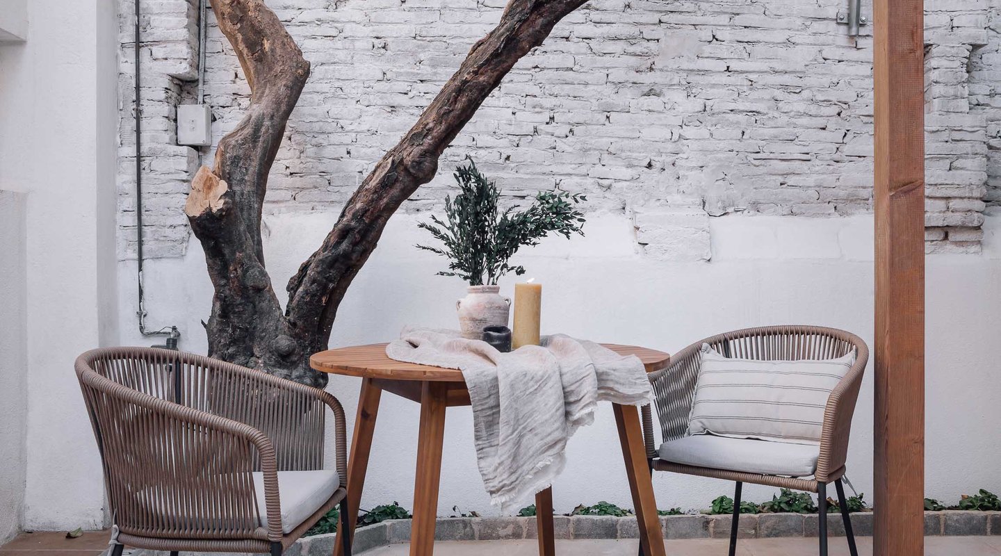 Outdoor terrace with seating, offering a serene atmosphere in Barcelona apartment