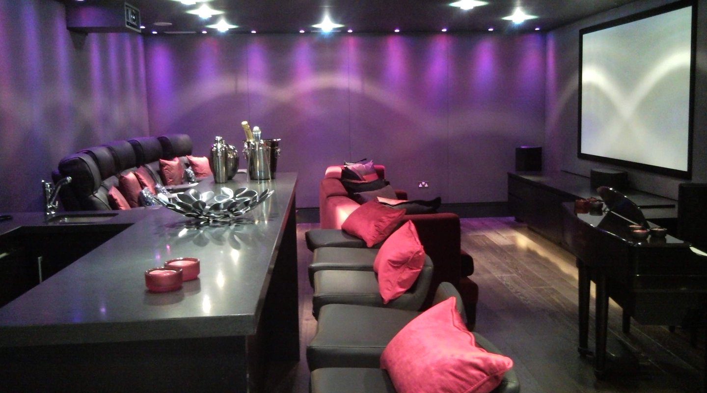 Fabric wall finish in a residential media room and home cinema