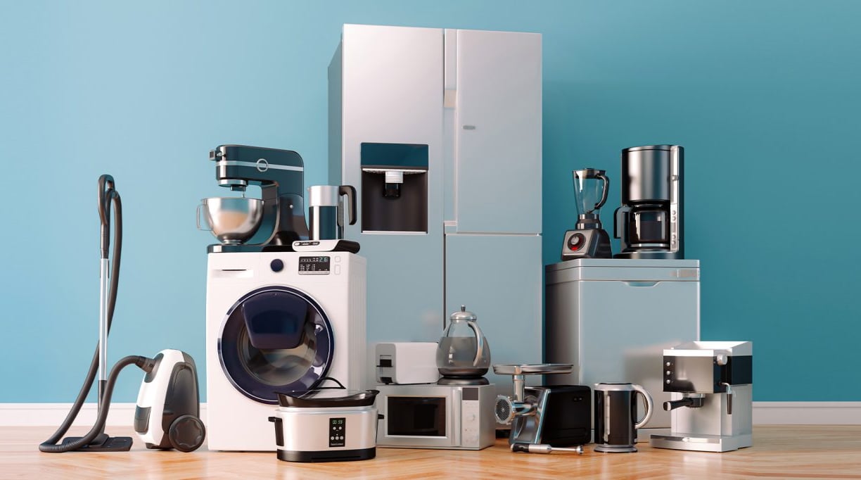 A variety of modern household appliances, including a refrigerator, washing machine, vacuum cleaner, and kitchen mixers,