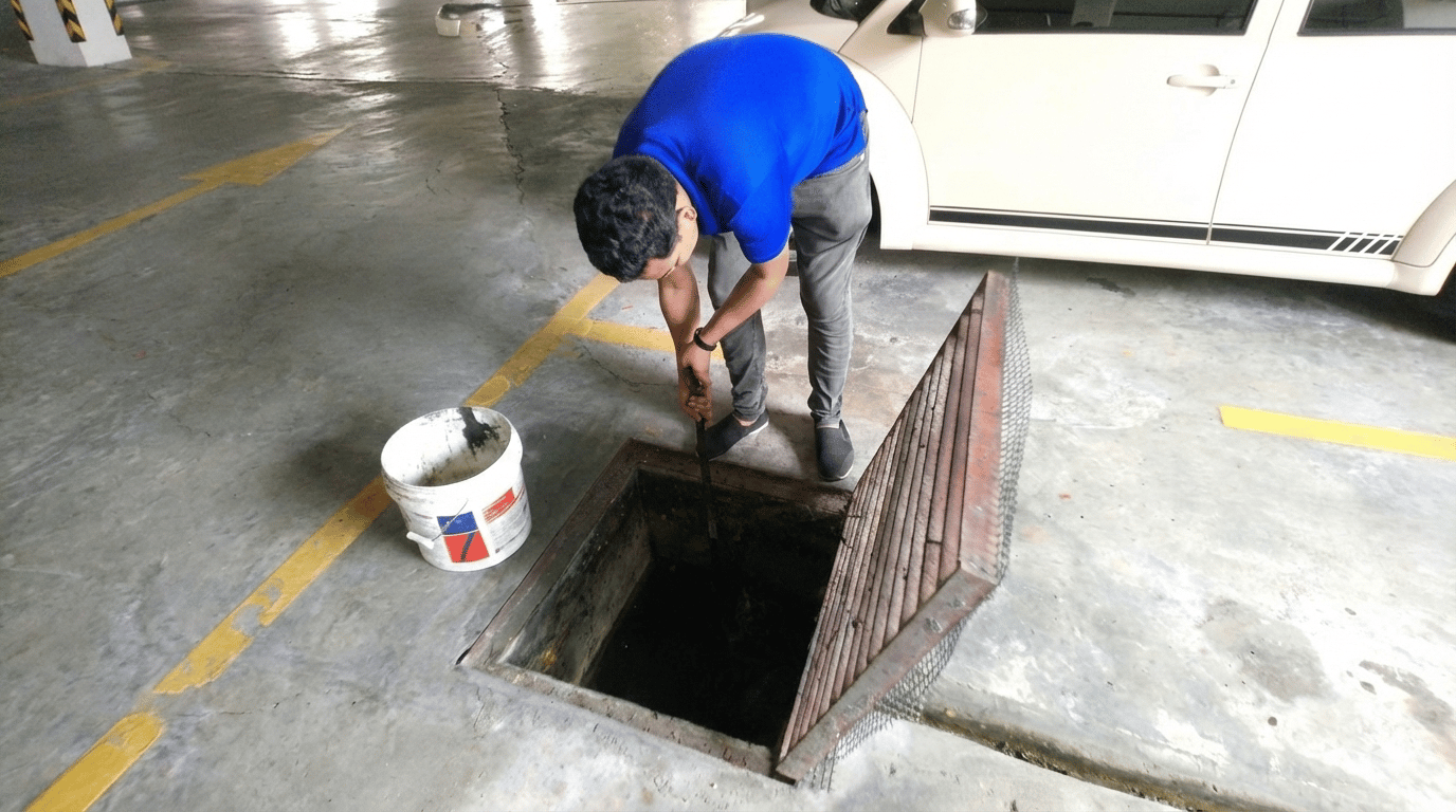 Expert grease trap cleaning by TOT Cleaning & Landscape Service Sdn Bhd.