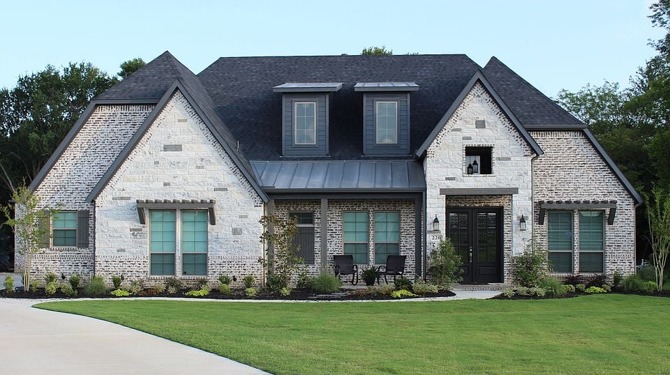 a house with a large driveway and a driveway