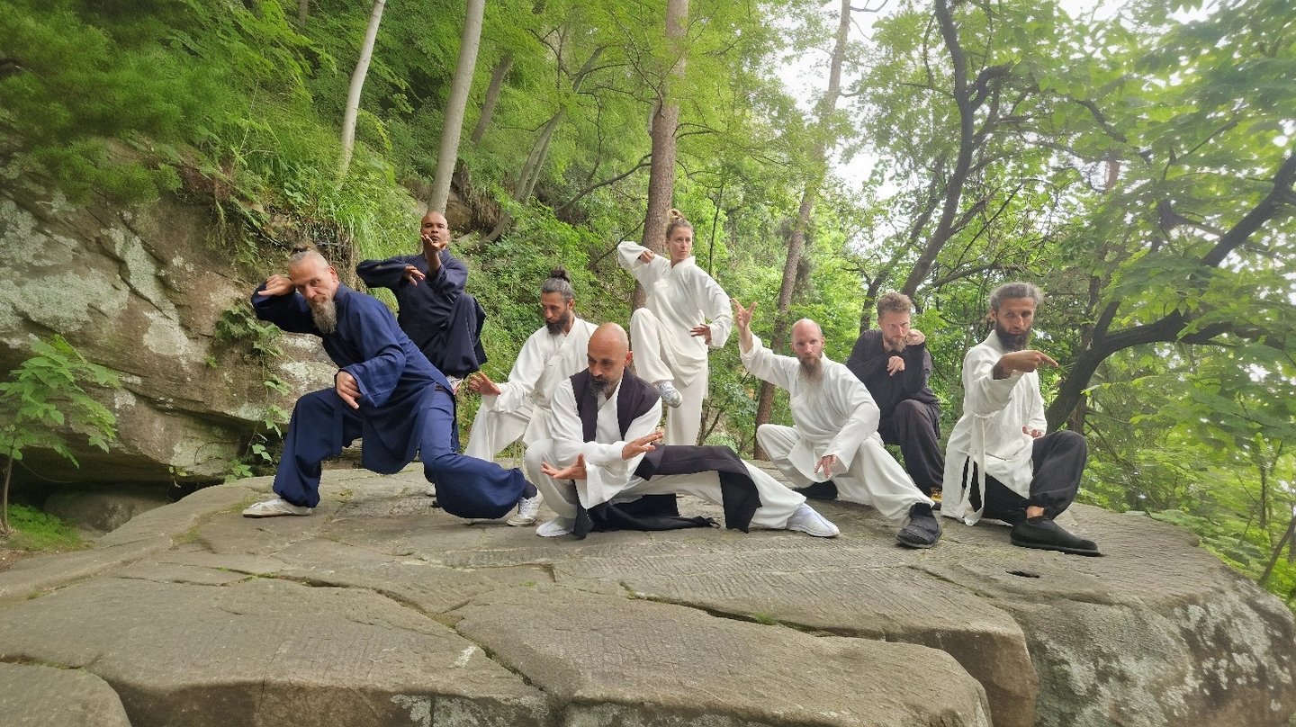 In the heart of nature, a Wudang family moves in harmony, weaving Tai Ji and Bagua into life.