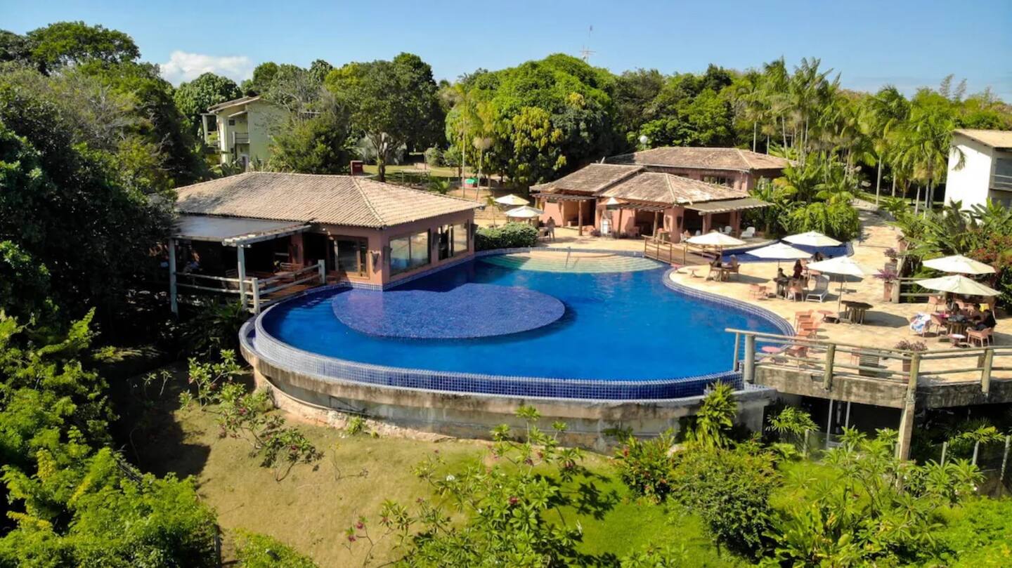 a large pool with a deck and a deck with chairs
