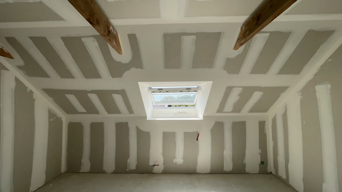 a room with a skylight and a skylight