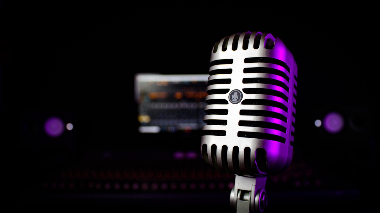 old microphone in recording studio with purple glow