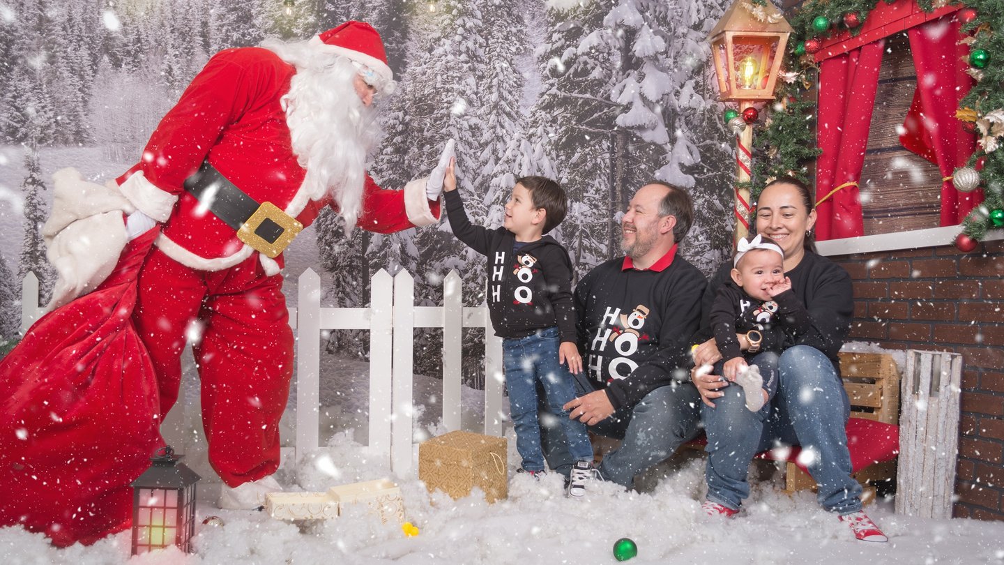 a family posing for a photo with santa claus claus claus claus claus claus claus claus