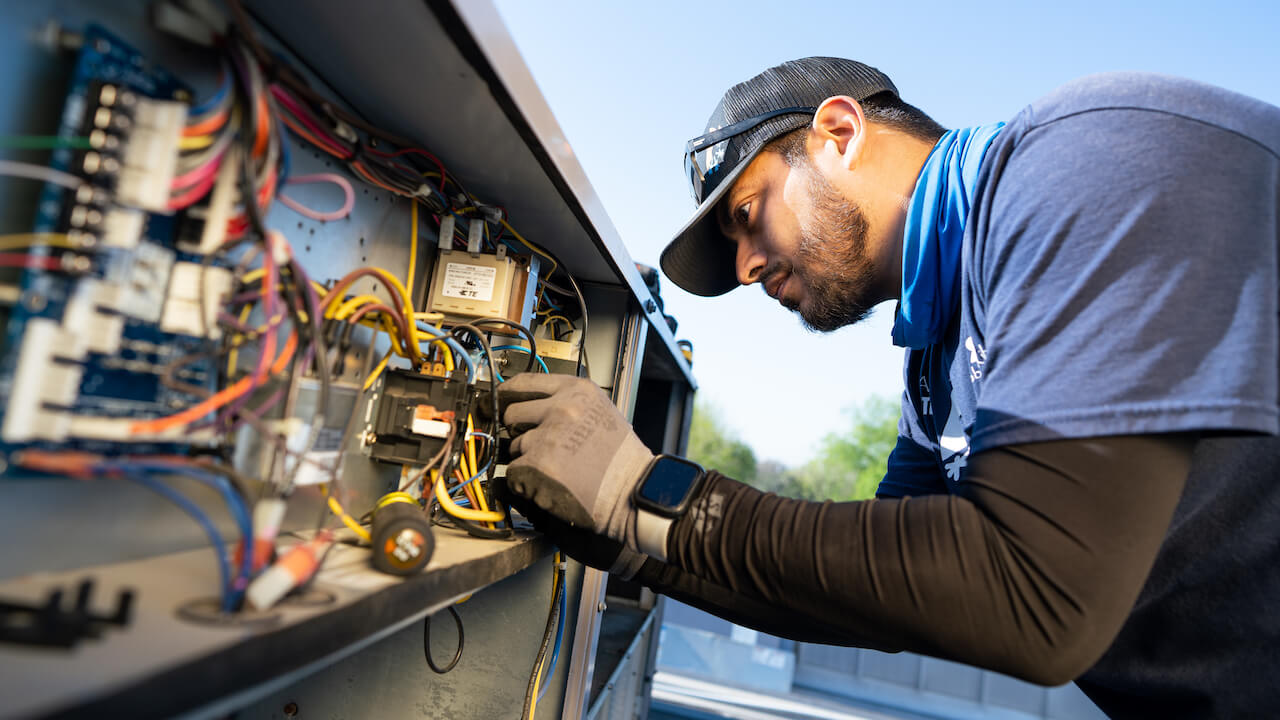 HVAC technician serving a commercial ac unit in Nashville Tennessee