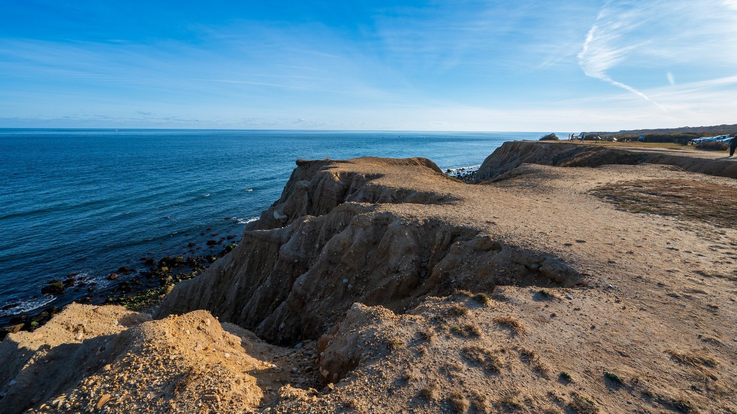 bluffs and dirt overlooking the atlantic ocean with the horizon in background, montauk ny