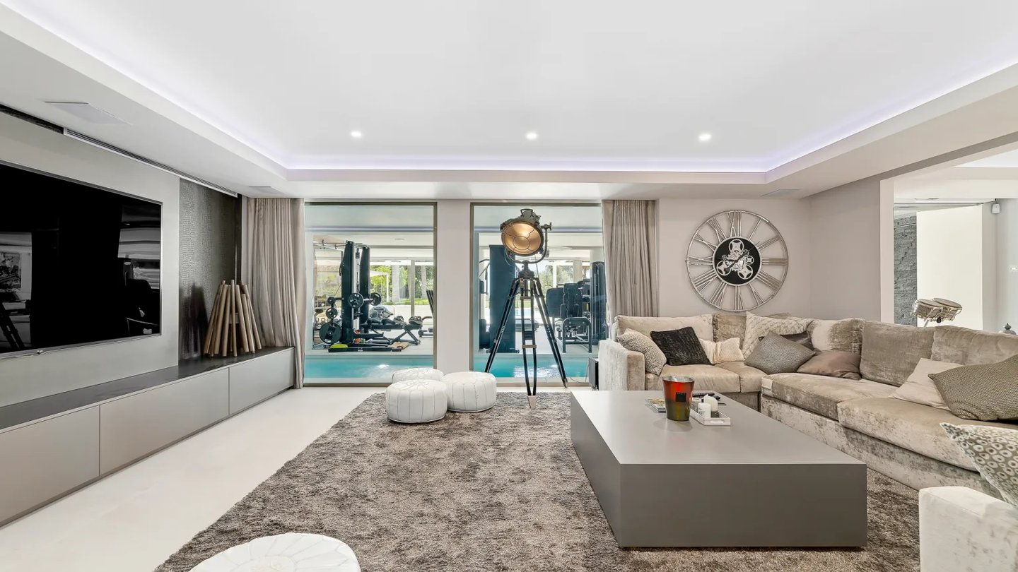 Villa Serenity TV room with large sofa and spa views