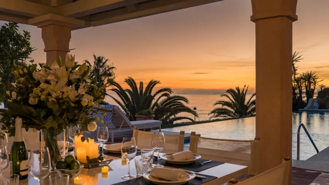 Sunset poolside dinner at Villa El Rincon with candles