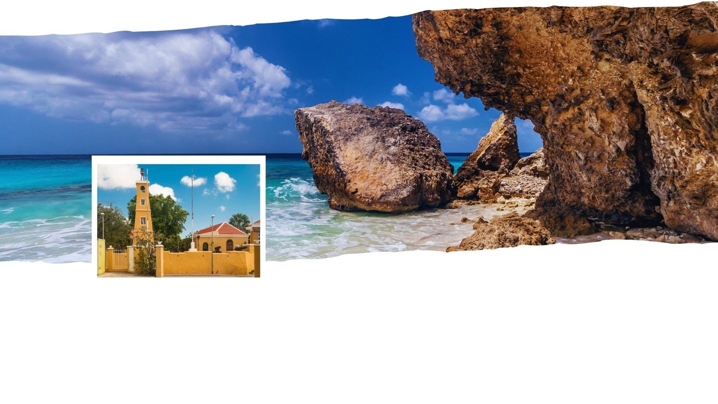 Vista de Kralendijk com praia ao fundo e o centro colorido em destaque.