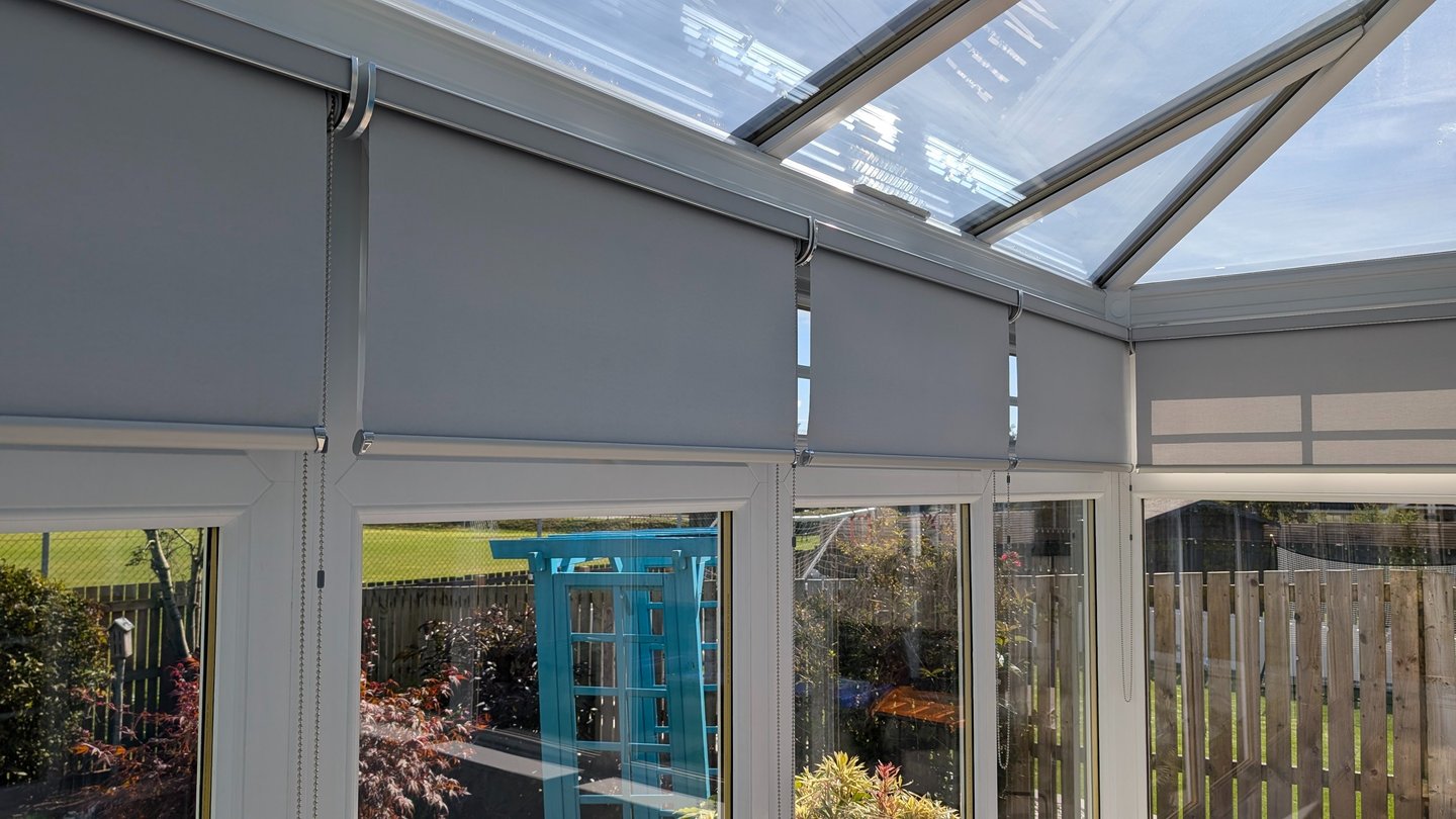 Blackout roller blinds in cassette headbox installed in Aberdeen conservatory