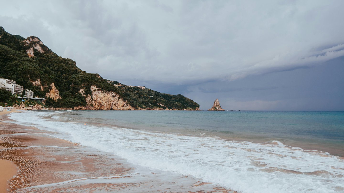 a beach with a boat in the water